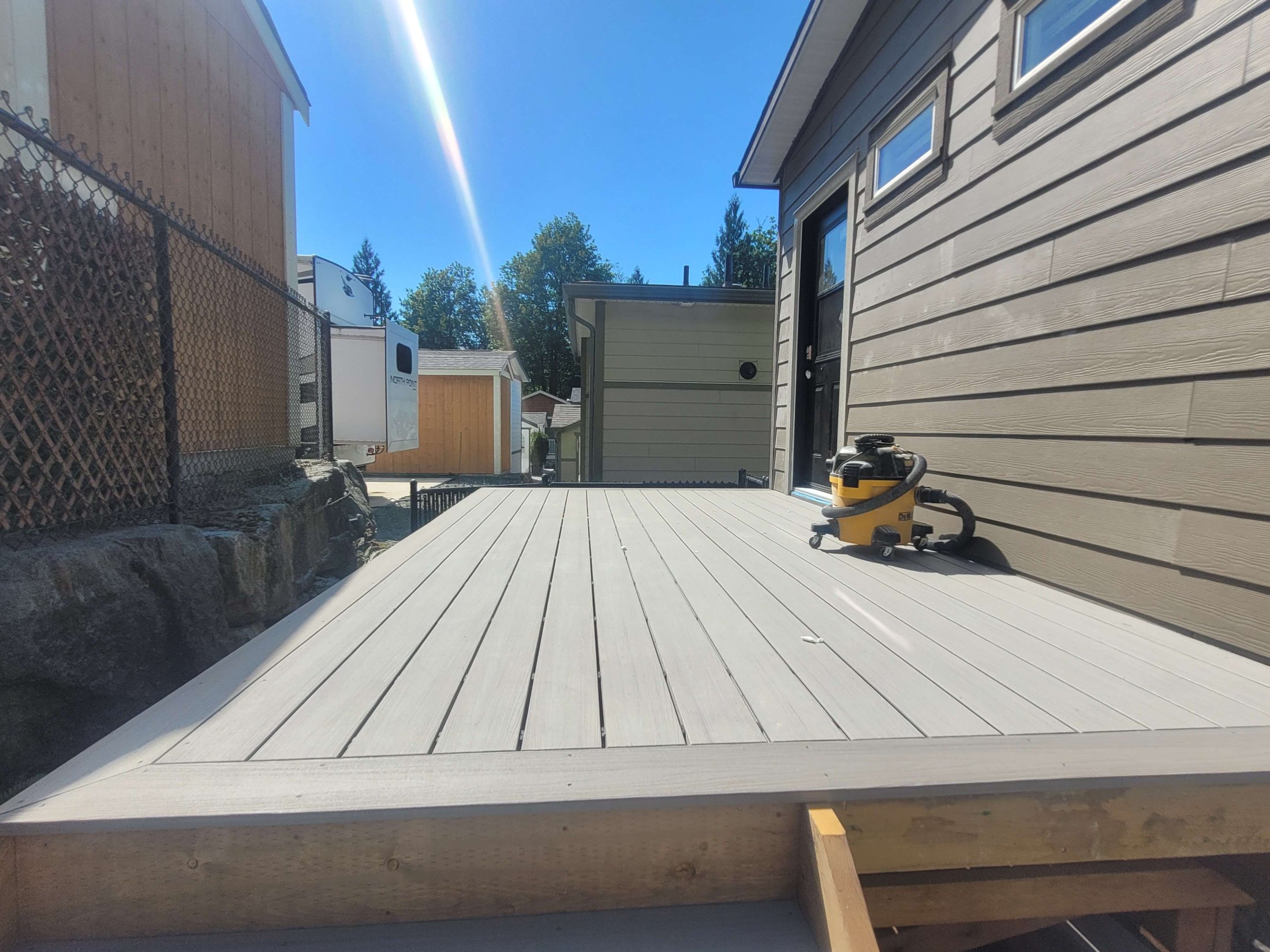 Gray composite deck surface after installation