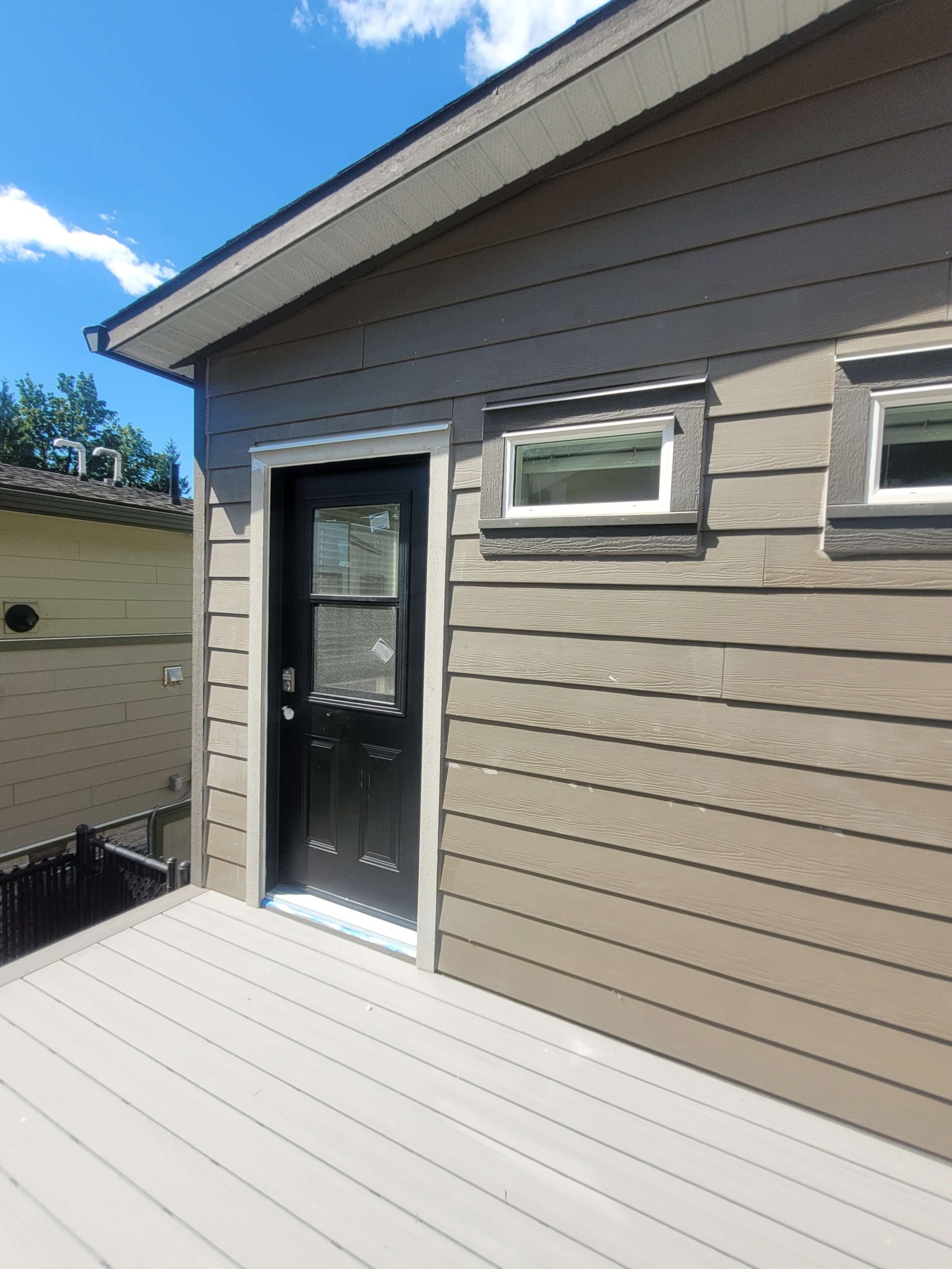 New exterior bedroom door after trim and siding were restored