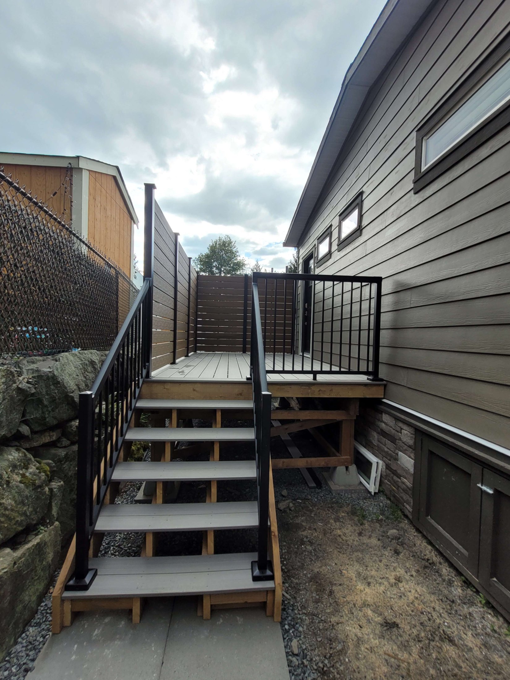 Completed stairs with Peak railing leading to the private deck