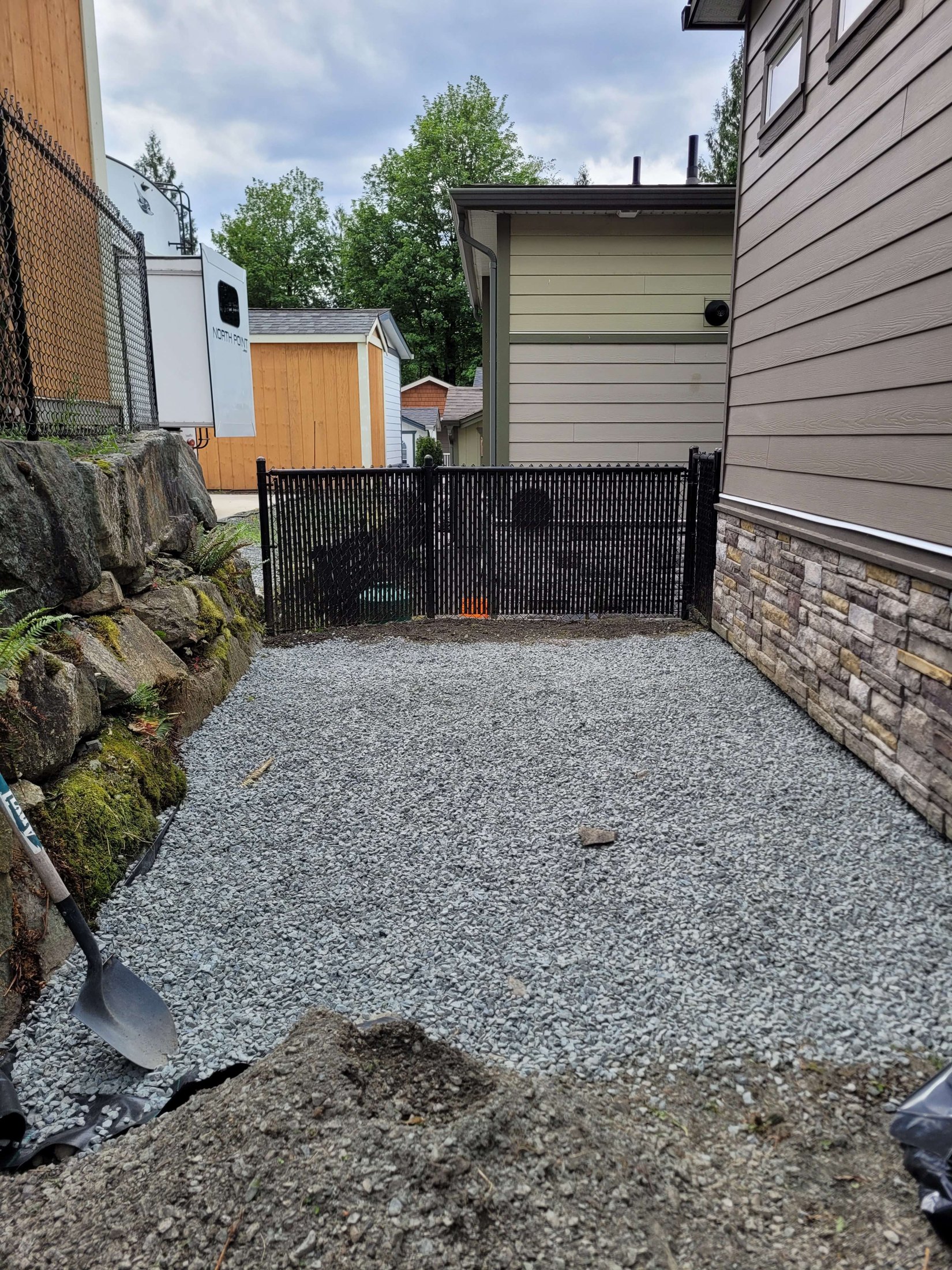 Prepared gravel base over weed barrier