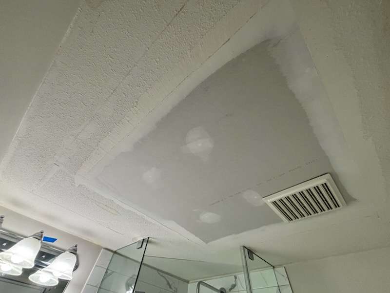 Ceiling drywall damage before repair - photo 1