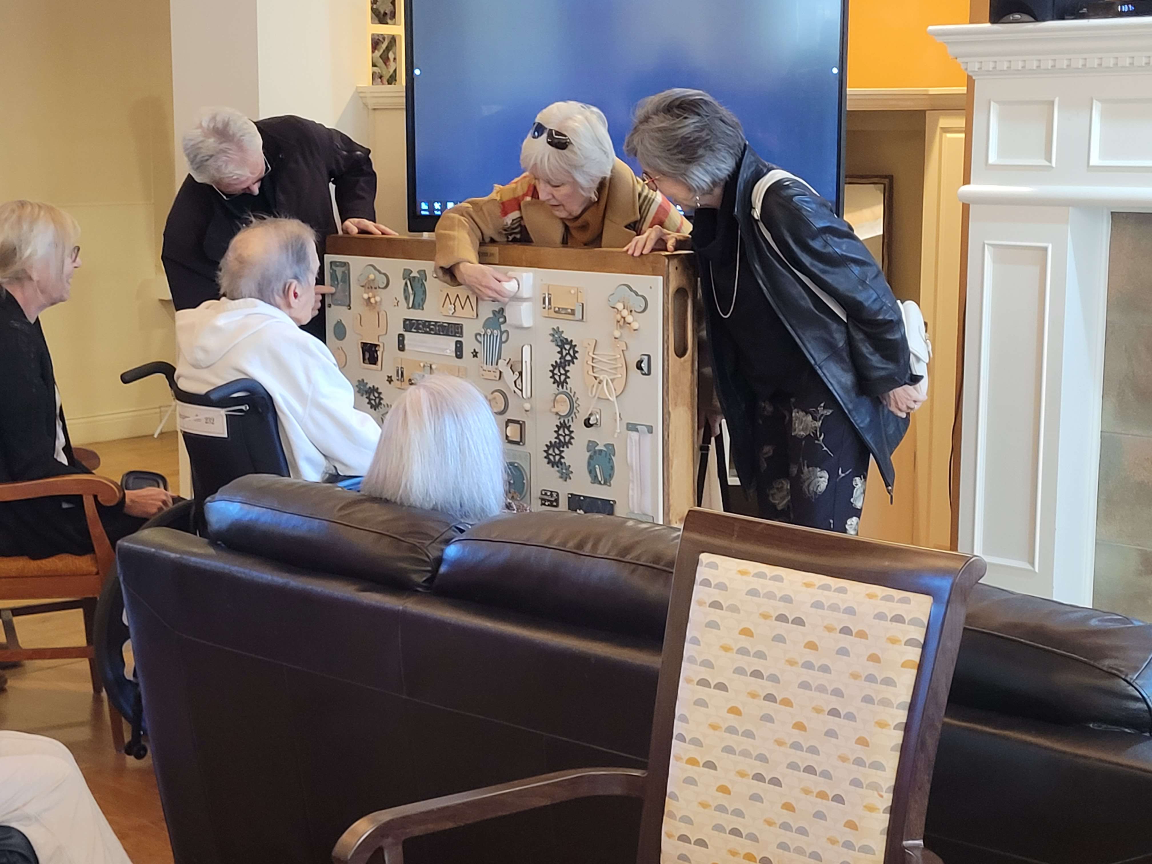 Client presenting the fidget board frame at Waverly - photo 2