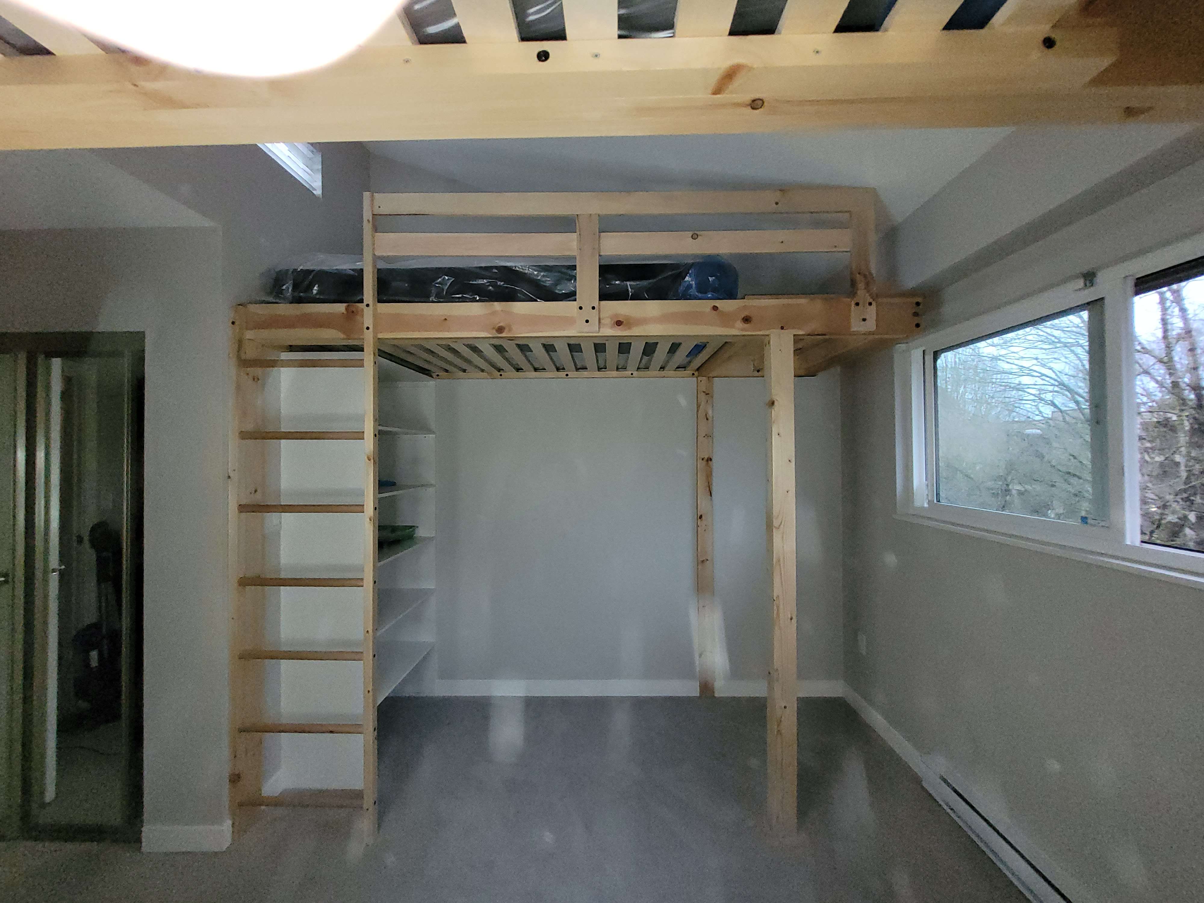 Custom carpentry project - Custom pine kids bunkbed with floor and storage space.