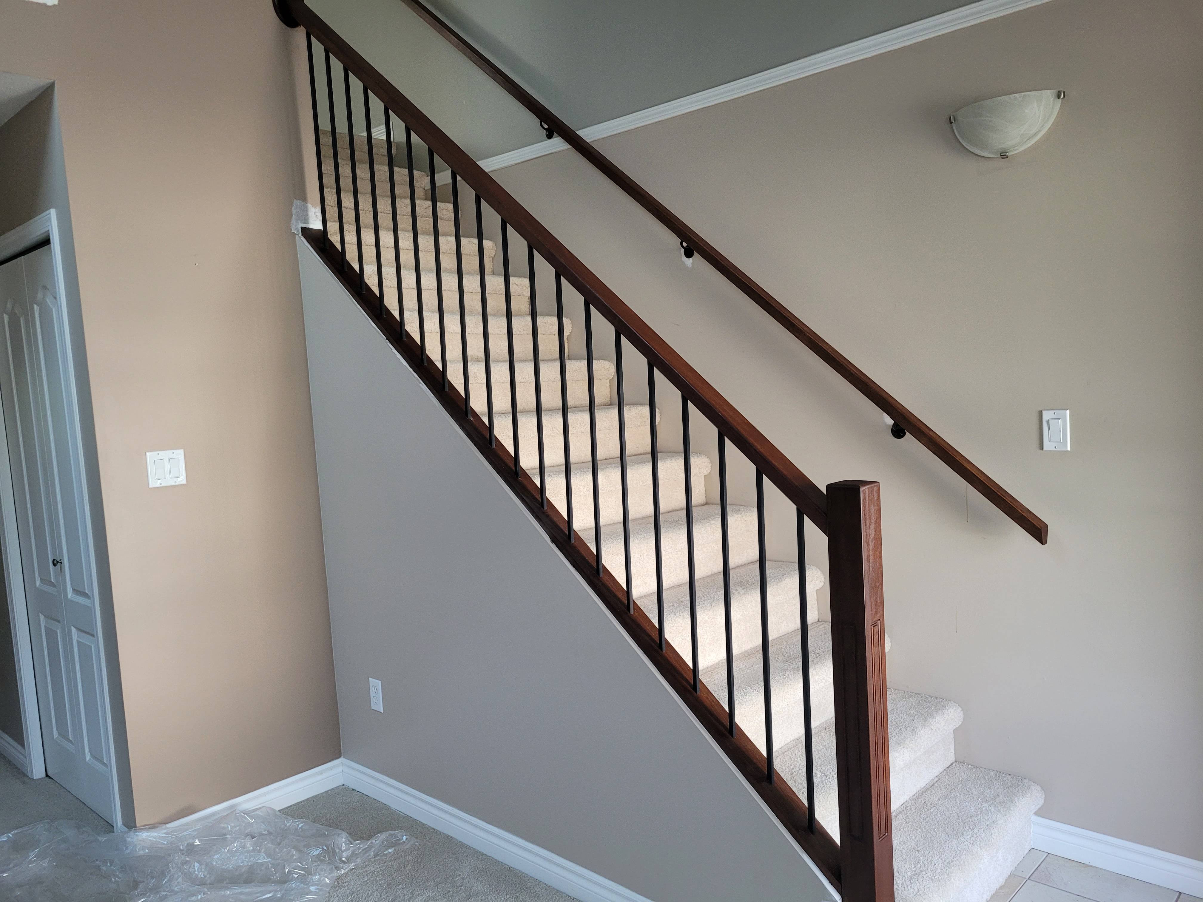 New wood handrail with smooth transitions and secure mounting